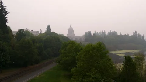 Drone pull of Wahington state capitol building and surrounding buildings, lake Stock Footage 139247091