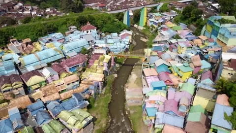 Drone Pullback and Ascent Over Colorful Village, Malang, Indonesia Stock Footage 315190998