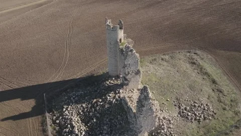 Drone pullback and ascent revealing Caudilla castle and surrounding farmland Stock-Footage 333610876