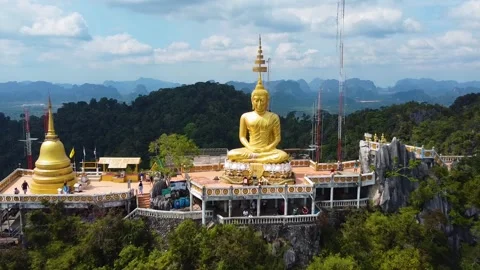 Drone Pullback from Buddha Face Revealing Wat Tham Suea Temple Stock Footage 331224717