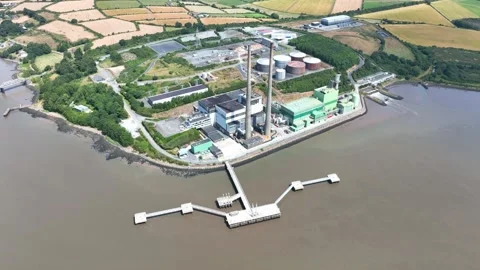 Drone pullback capturing renewable energy power station on the River Suir Stock Footage 342239682
