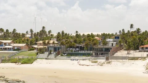 Drone pullback from Carmel Taíba Exclusive Resort to Atlantic coastline Ceará Video stock 333989193