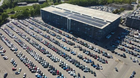 Drone Pullback from Huge Car Storage Facility and Rows of Vehicles Stock Footage 346597850