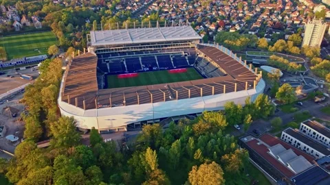 Drone pullback from Meinau stadium revealing Strasbourg Stock Footage 334506958