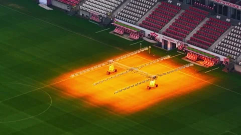 Drone Pullback Over Cracovia Stadium Pitch with Grow Lights in Krakow Lesser Stock-Footage 337043676