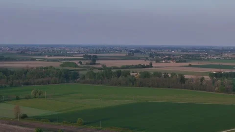 Drone pullback over Po Valley farmland and rural landscape near Piacenza Stock Footage 334719383