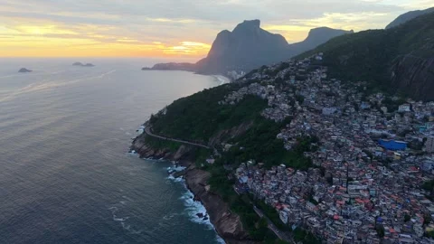 Drone pullback over Vidigal favela and Dois Irmãos headland Rio de Janeiro Stock Footage 334387478