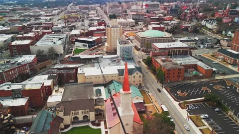 Drone Pullback from Red Steeple Over Downtown Macon Stock Footage 347908745