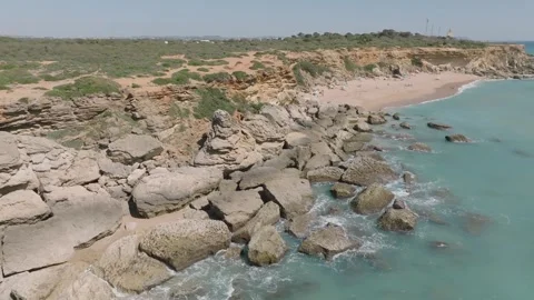 Drone Pullback Reveal of Cala del Tío Juan Medina, Conil de la Frontera, Spain Video stock 333009189
