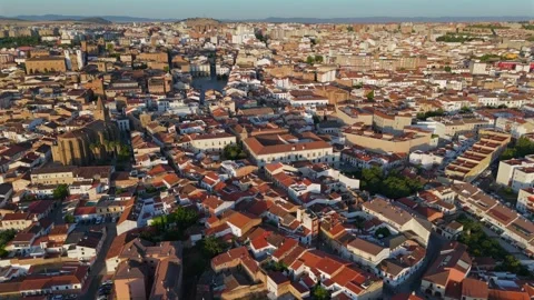 Drone pullback revealing Caceres medieval towers and churches at sunrise Stock-Footage 342321350