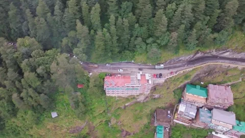 Drone pullback revealing hotels on a steep cliff in Shimla. 스톡 동영상 333056349