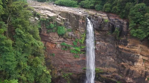 Drone Pullback Revealing Laxapana Waterfall and Cliff in Sri Lanka Stock Footage 339291155