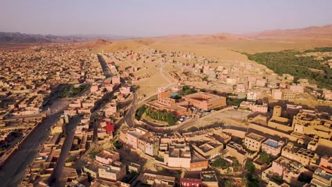 Drone pullback revealing mosque complex and urban boulevard in Tinghir Morocco Stock-Footage 336622389