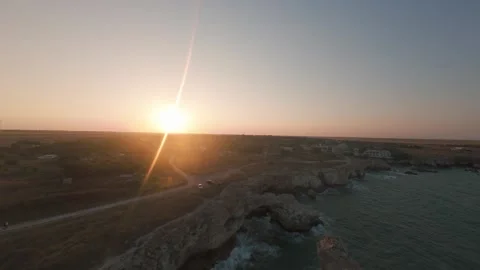 Drone pullback revealing natural sea arch at sunset in Tyulenovo, Bulgaria. Stock Footage 342224648