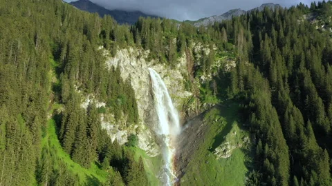 Drone Pullback Revealing Stäubifall Waterfall, Rainbow and Alpine Panorama Stock-Footage 339802242