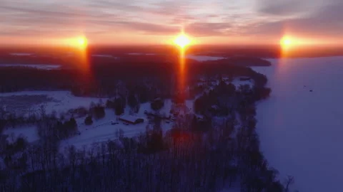 Drone Pullback Revealing Sundog Over Lake Resort in Callaway Minnesota Stock-Footage 330889736