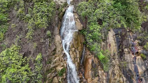 Drone Pullback Revealing a Tall Waterfall on Khanh Le Pass, Vietnam Stock Footage 343720084