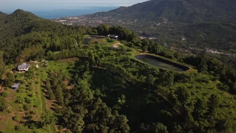 Drone Pullback Revealing Tropical Mountain Farm and Coastal Landscape Vidéo 337345156