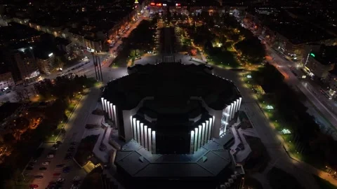 Drone Pullback Reveals Illuminated National Palace of Culture and Sofia Stock Footage 321898434
