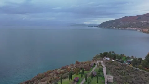 Drone Pullback from Roman Fort Revealing Bay of Bones Museum, Lake Ohrid Stock Footage 331695259