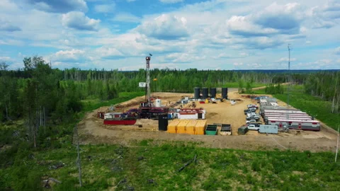 Drone Pullback Shot of an Oil Drilling Pad in Summer, Alberta, Canada Stock Footage 341919024
