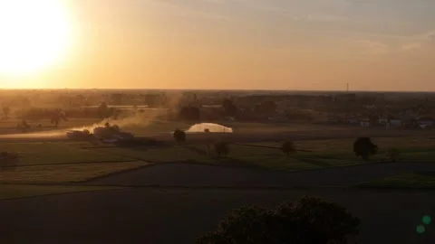 Drone pullback slide over irrigated farmland during 2026 heatwave in the Po Stock Footage 342235134