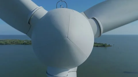 Drone pullback from wind turbine over water Stock Footage 339682996