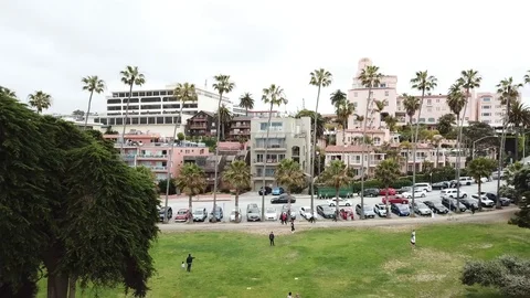 Drone pulling away from beach park into the ocean Stock Footage 90368213