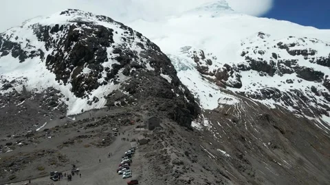 Drone Pulling Away From Snow-Capped Mountain Revealing Glaciers Stock Footage 343419879