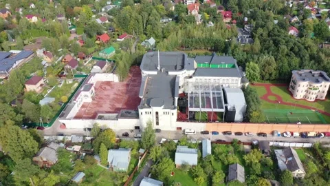 Drone pulling back above Event Hall Zhavoronki complex Stock Footage 330360625