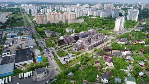 Drone pulling back and ascending above medical center Video stock 328487889