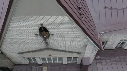 Drone pulling back over rooftop of old building Stock Footage 333484690