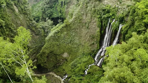 Drone Pulling Back Over Tumpak Sewu Waterfalls Stock-Footage 146104460
