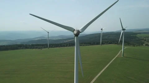 Drone Pulling Back Smoothly from Wind Turbine Center Stock Footage 314940428