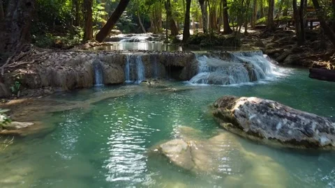 Drone Pulling Back from Waterfalls in Erawan National Park Vídeo Stock 331940619