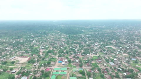 Drone pulling upward away from Betou town, overall view, Congo Vídeos de archivo 331999103