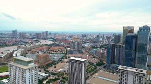 Drone pulls back, cityscape of Koh Pich Island with stunning architecture Video stock 282952248