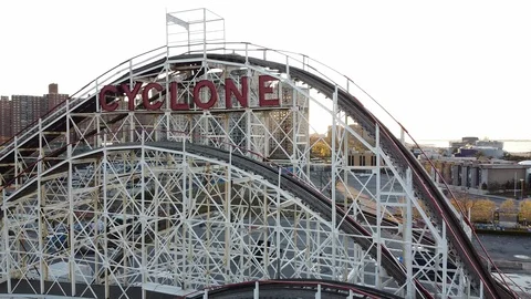 Drone pulls back from Cyclone Roller Coaster Coney Island Stock Footage 129759668