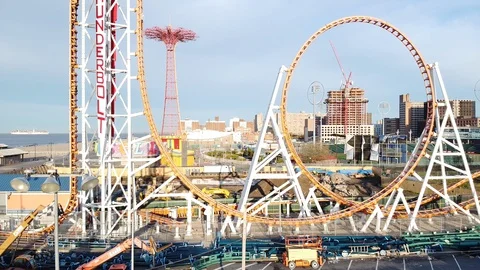 Drone pulls back flyover Luna Park Coney Island Stock Footage 129768521