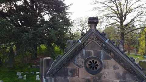 Drone pulls back from gothic mausoleum Greenwood Cemetery Stock Footage 129276730