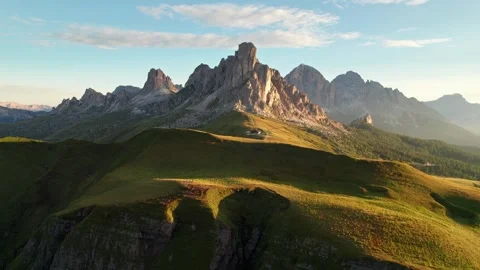 Drone pulls back from La Gusela ridge at sunrise, Passo di Giau Video stock 346288243