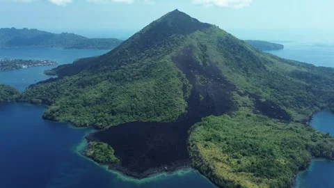 Drone pulls back over lava field and coral reef Video stock 327472692