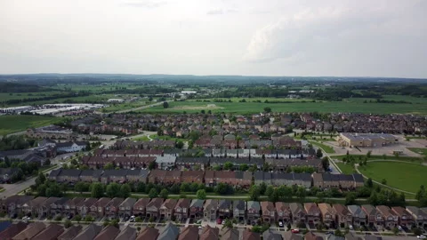 Drone Pulls Back to Reveal a Small North American Town Stock Footage 347151551