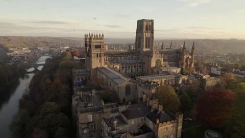 Drone pulls slowly back from Durham Cathedral at dawn Stock Footage 279459429