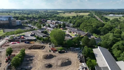 Drone push across a building site within hospital grounds Stock Footage 307515958