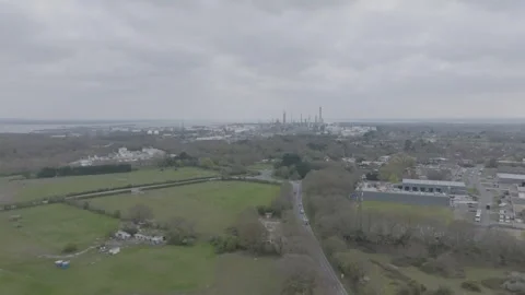 Drone push across New Forest countryside towards Fawley power station Stock Footage 306620600