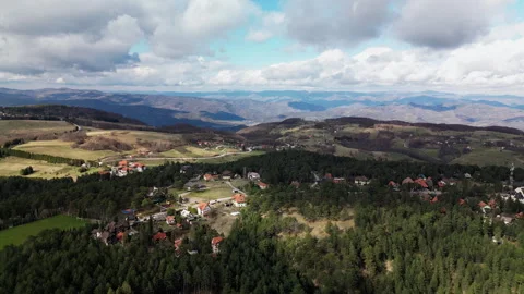 Drone push-in and rise over Tara Mountain village and pine forest, Serbia Stock Footage 328229242
