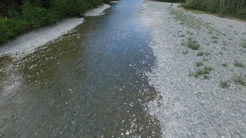 Drone Push Back Man Walking Along River  Stock Footage 92176164