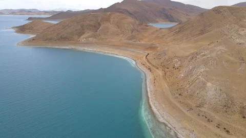 Drone Push Forward Along Shoreline of Yamdrok Lake, Tibet Plateau Landscape Stock Footage 326205611