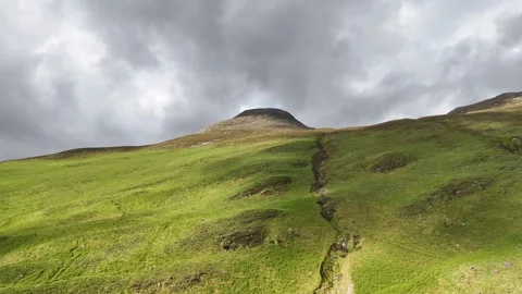 Drone push forward boom up of Pap of Glenco mountain, spring afternoon. Stock Footage 337177648